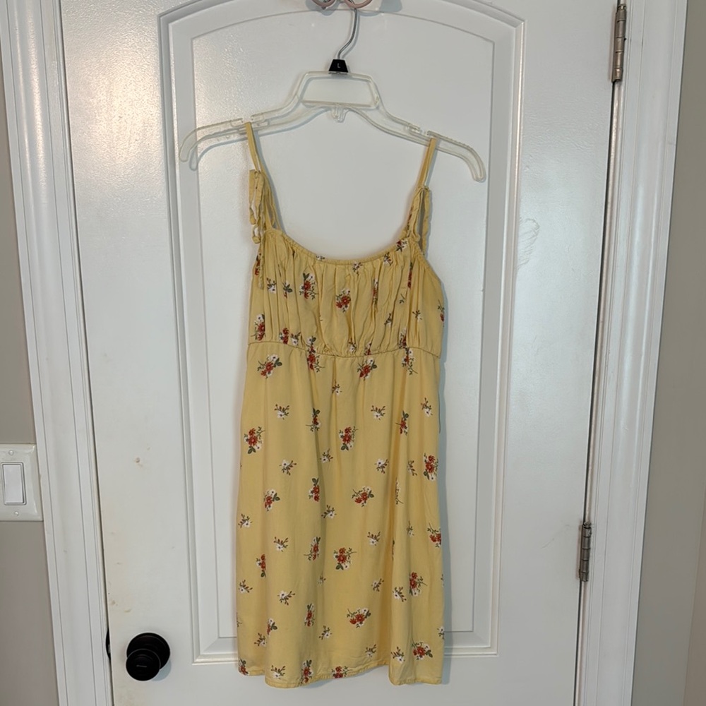 Yellow holster dress with red floral print